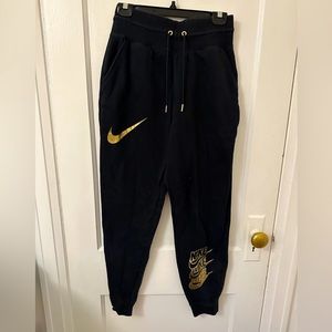Black and gold Nike sweatpants